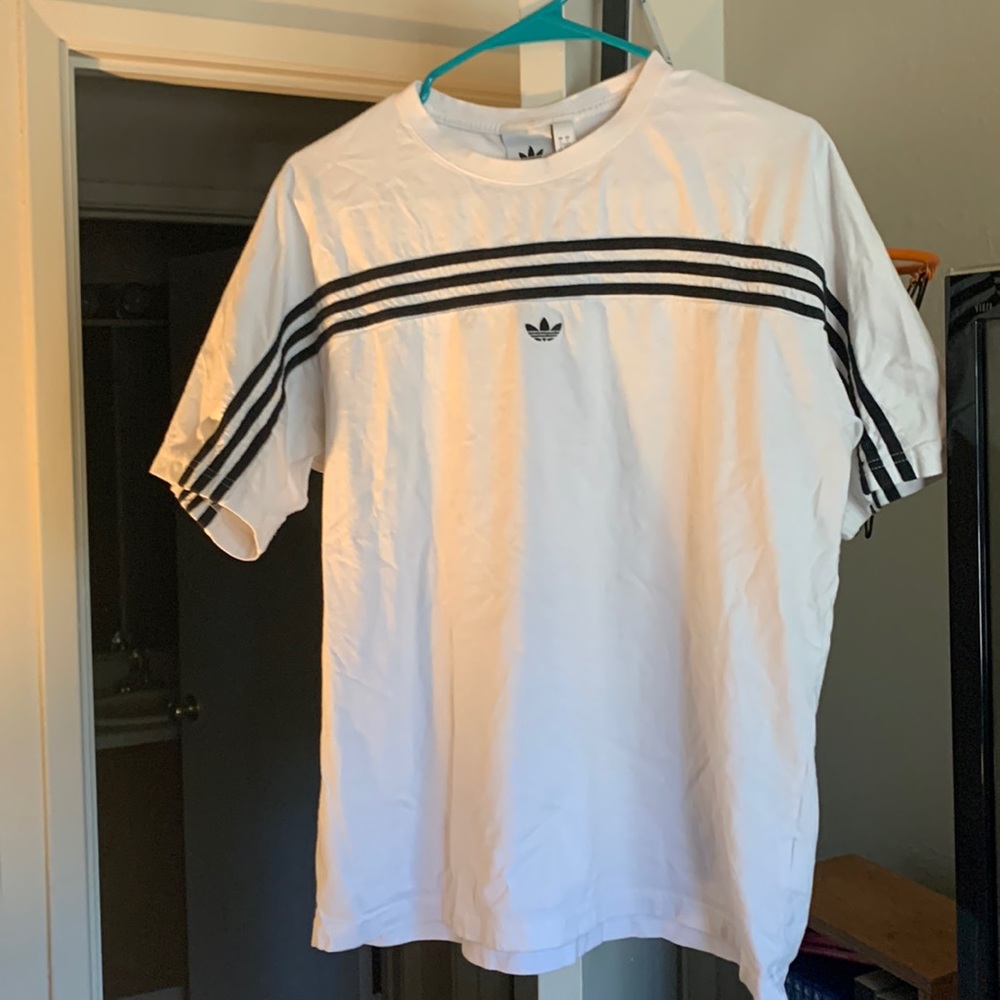 White adidas tee shirt with black stripes across the chest in good condition